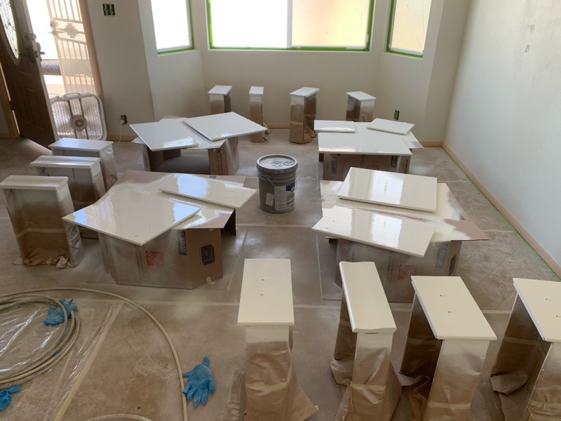 Cabinet doors and drawer fronts laid out for professional spray finishing